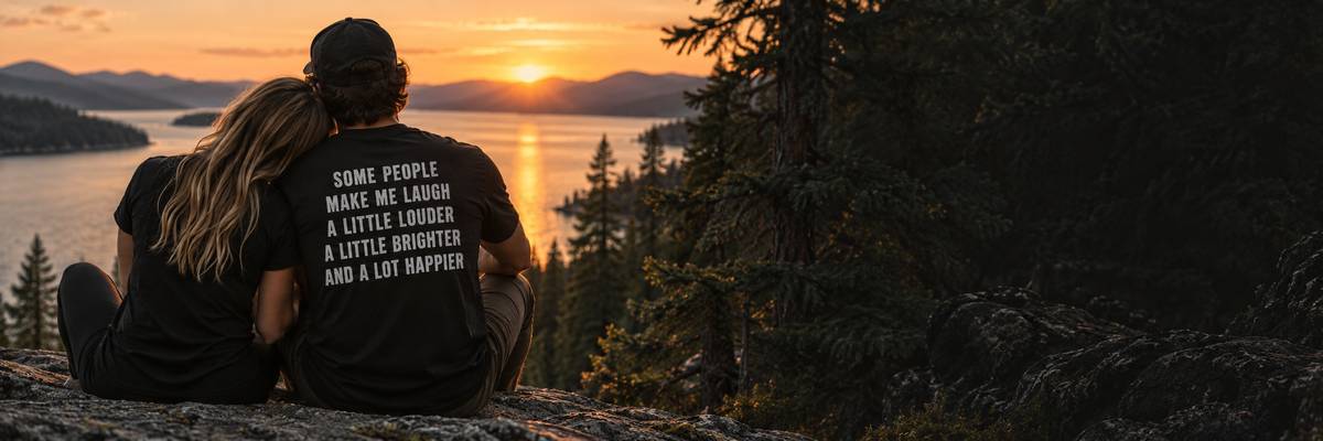Couple wearing black shirts together by the lake